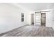 Spacious bedroom featuring new floors, large windows, and a modern bathroom sliding door with shower at 3845 Springleaf Ct, Stone Mountain, GA 30083