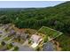 Aerial view of the home situated on a wooded lot, highlighting privacy and beautiful natural surroundings at 4371 Wigley Preserve Dr, Marietta, GA 30066