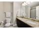 Bathroom featuring dual sinks with granite countertops, neutral walls, and a large mirror at 4371 Wigley Preserve Dr, Marietta, GA 30066