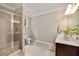 Bathroom featuring a glass-enclosed shower, dual sink vanity, and neutral color palette at 4371 Wigley Preserve Dr, Marietta, GA 30066