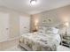 Comfortable bedroom featuring neutral walls, carpeted floors, and bright overhead lighting at 4371 Wigley Preserve Dr, Marietta, GA 30066
