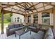 A large covered patio complete with overhead fan and outdoor furniture provides ample entertaining space at 4371 Wigley Preserve Dr, Marietta, GA 30066