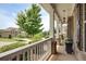 Inviting front porch with white railing, offering serene views of the surrounding neighborhood at 4371 Wigley Preserve Dr, Marietta, GA 30066