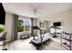 Home gym boasts a large window with views and mirrored wall with mounted TV at 4371 Wigley Preserve Dr, Marietta, GA 30066