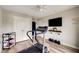 Bright home gym with ceiling fan and mounted TV, offers a motivational message at 4371 Wigley Preserve Dr, Marietta, GA 30066
