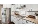 Kitchen features stainless steel appliances, granite countertops, and white cabinets at 4371 Wigley Preserve Dr, Marietta, GA 30066