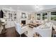 Bright living room featuring built-in bookshelves, a fireplace, and hardwood floors for a cozy gathering space at 4371 Wigley Preserve Dr, Marietta, GA 30066
