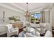 Elegant living room featuring tray ceilings, large window and comfortable seating arrangement at 4371 Wigley Preserve Dr, Marietta, GA 30066
