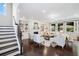 Cozy living room boasts a fireplace, hardwood floors, built-in shelving, and large windows for natural light at 4371 Wigley Preserve Dr, Marietta, GA 30066