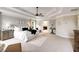Spacious main bedroom with tray ceiling and fan with adjoining bath and sitting area at 4371 Wigley Preserve Dr, Marietta, GA 30066