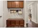 Mudroom with built-in bench, storage cabinets, and hooks for coats and bags at 4371 Wigley Preserve Dr, Marietta, GA 30066