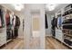 Spacious walk-in closet featuring custom shelving and ample storage space for clothing and accessories at 4371 Wigley Preserve Dr, Marietta, GA 30066