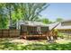 Spacious backyard with a wooden deck, lush greenery, and ample space for outdoor entertainment at 936 Ormewood Se Ter, Atlanta, GA 30316