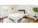 Bright bedroom with hardwood floors, minimalist decor, and large windows offering ample natural light at 936 Ormewood Se Ter, Atlanta, GA 30316