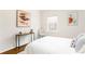 Calm bedroom featuring a white bedspread, modern art, and natural light from a window at 936 Ormewood Se Ter, Atlanta, GA 30316