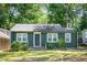 Charming single-story home with green siding, well-maintained lawn, and inviting front entrance at 936 Ormewood Se Ter, Atlanta, GA 30316