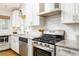 Updated kitchen with granite counters, stainless appliances, and white subway tile backsplash at 936 Ormewood Se Ter, Atlanta, GA 30316