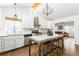 Bright, updated kitchen with an island, stainless steel appliances, and white cabinetry at 936 Ormewood Se Ter, Atlanta, GA 30316
