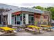 Modern restaurant exterior with neon sign, outdoor seating, and colorful 'Holy Taco' mural at 936 Ormewood Se Ter, Atlanta, GA 30316