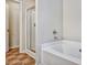 Bathroom featuring a shower and tub with a tile floor at 1233 Miss Irene Ln, Lawrenceville, GA 30044