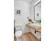 Modern powder room with wood floors, vessel sink, and contemporary finishes at 1233 Miss Irene Ln, Lawrenceville, GA 30044