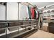 Organized walk-in closet features metal shelving and hanging rods at 1233 Miss Irene Ln, Lawrenceville, GA 30044