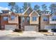 Attractive townhome exterior with brick and siding details and a garage at 1233 Miss Irene Ln, Lawrenceville, GA 30044