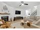 Stylish living room with a fireplace, modern furniture, and ample natural light at 1233 Miss Irene Ln, Lawrenceville, GA 30044
