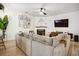 Cozy living room with fireplace, modern decor, and comfortable sectional sofa at 1233 Miss Irene Ln, Lawrenceville, GA 30044
