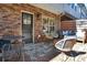 Cozy brick patio with stylish outdoor seating and string lights at 1233 Miss Irene Ln, Lawrenceville, GA 30044