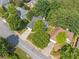 An aerial view of a home with a driveway, surrounded by mature trees and landscaping at 139 Mountain Vista Blvd, Canton, GA 30115