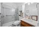Modern bathroom with glass enclosed shower, white cabinets, and updated fixtures at 139 Mountain Vista Blvd, Canton, GA 30115