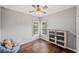 Comfortable bedroom features hardwood floors, ceiling fan, and bright natural light at 139 Mountain Vista Blvd, Canton, GA 30115