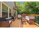 Cozy deck with wicker furniture, offering a comfortable spot to relax and enjoy the surrounding green landscape at 139 Mountain Vista Blvd, Canton, GA 30115