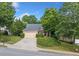 Charming home with well-manicured lawn, driveway, and lush green trees in a suburban setting at 139 Mountain Vista Blvd, Canton, GA 30115