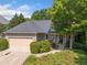 Charming home featuring a two-car garage, landscaped yard, and inviting front entrance at 139 Mountain Vista Blvd, Canton, GA 30115