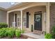 Charming front porch featuring rocking chairs, complemented by well-maintained landscaping at 139 Mountain Vista Blvd, Canton, GA 30115