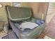 An inviting hot tub partially uncovered, ready for relaxation, set in a private outdoor area at 139 Mountain Vista Blvd, Canton, GA 30115