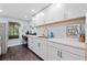 Modern kitchenette with sleek white cabinetry, stainless steel appliances, and ample counter space at 139 Mountain Vista Blvd, Canton, GA 30115