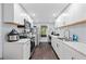 Modern kitchenette featuring stainless steel appliances, white cabinets, and lots of counter space at 139 Mountain Vista Blvd, Canton, GA 30115