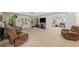 Spacious living room with a cozy fireplace, large windows, and comfortable seating arrangements at 139 Mountain Vista Blvd, Canton, GA 30115