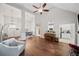 Bright living room boasts hardwood floors, high ceilings, and open floor plan to kitchen and dining area at 139 Mountain Vista Blvd, Canton, GA 30115