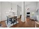 Open-concept living space with hardwood floors, fireplace, and plenty of natural light at 139 Mountain Vista Blvd, Canton, GA 30115