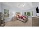 Spacious main bedroom featuring a tray ceiling and multiple windows at 139 Mountain Vista Blvd, Canton, GA 30115