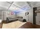 Basement features a neutral color scheme, recessed lighting, and a comfortable sectional couch at 1920 Pilgrim Rd, Cumming, GA 30040