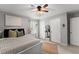 Neutral bedroom with natural light, ceiling fan, and closet at 1920 Pilgrim Rd, Cumming, GA 30040