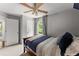 Comfortable bedroom with neutral walls, a wood bed, and natural light at 1920 Pilgrim Rd, Cumming, GA 30040