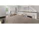 Bonus room with railing and entry to another bedroom at 1920 Pilgrim Rd, Cumming, GA 30040