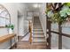 Inviting entryway with hardwood floors, staircase, and stylish decorative touches at 1920 Pilgrim Rd, Cumming, GA 30040