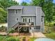 Back of house featuring an elevated deck overlooking the large fenced in backyard and pool at 1920 Pilgrim Rd, Cumming, GA 30040